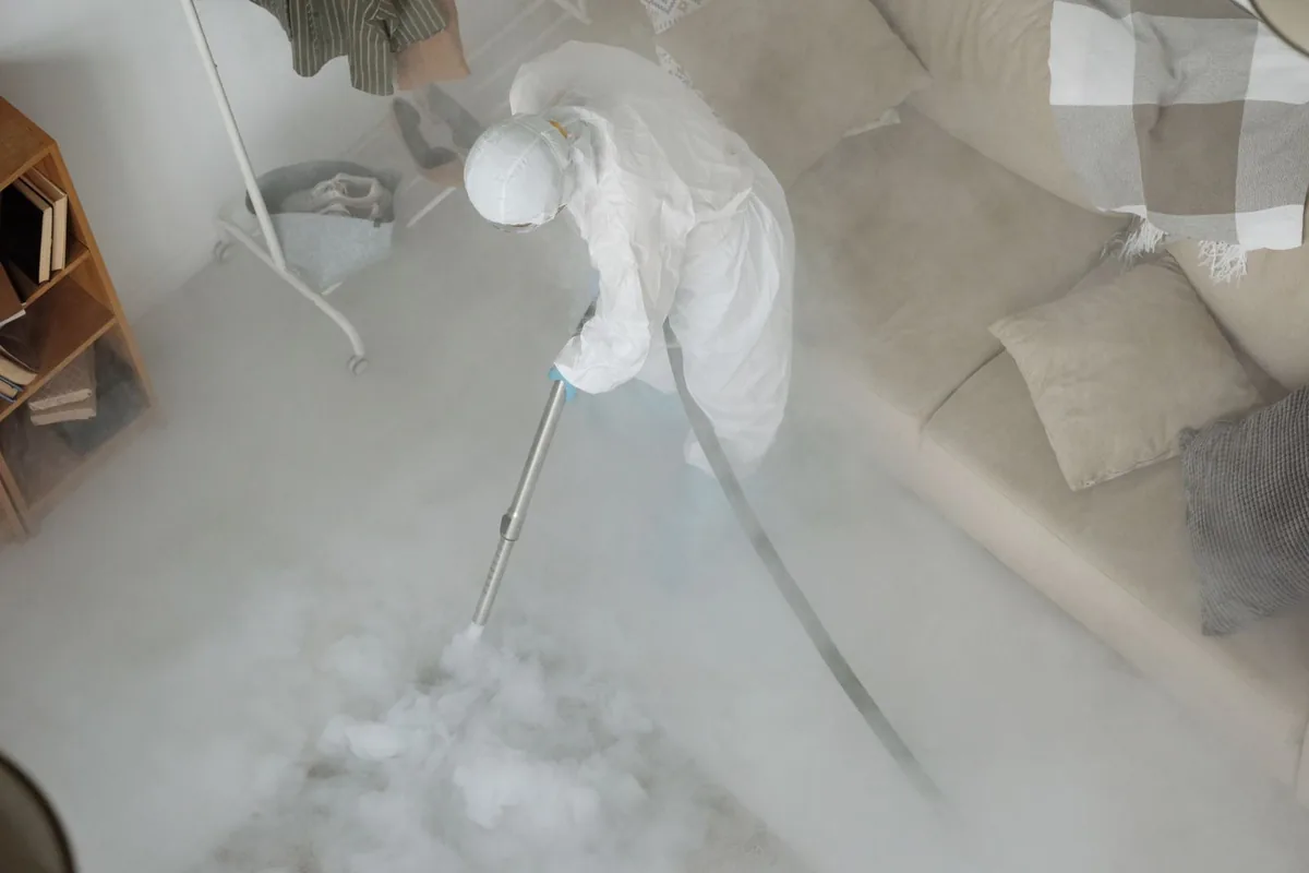 Biohazard cleanup technician in protective equipment, Putnam, CT